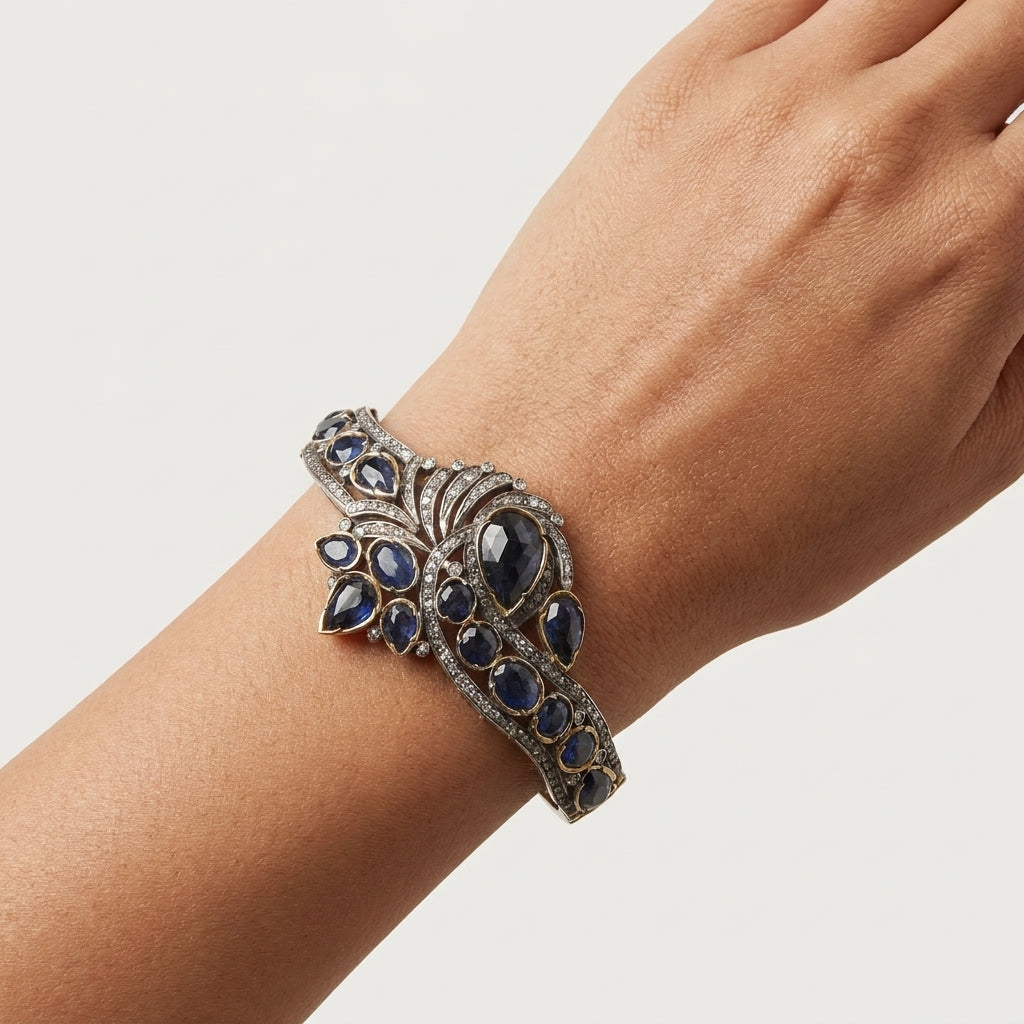 Close up of sapphire diamond bangle in polished sterling silver
