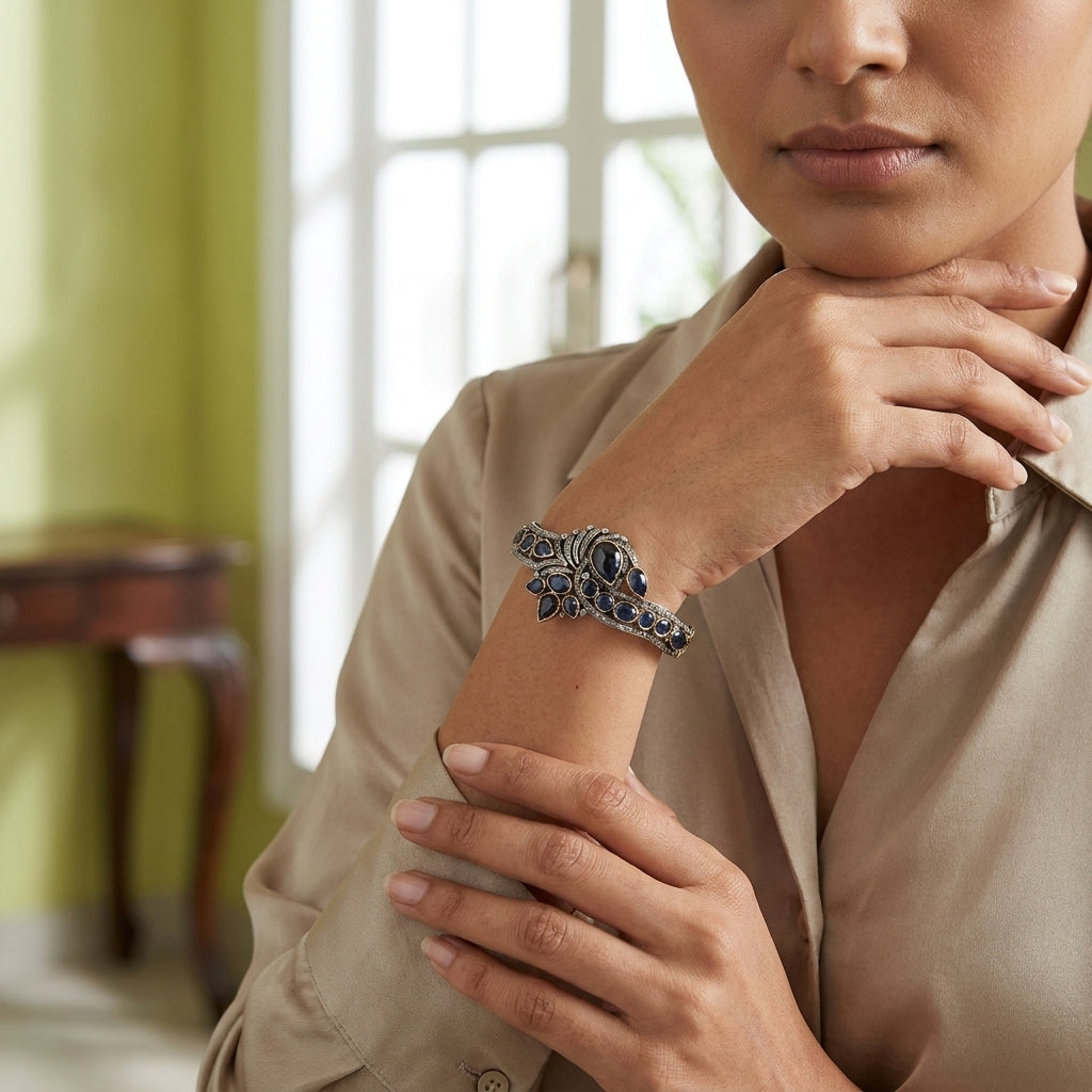 Handcrafted silver bangle featuring natural Thai sapphires and diamonds