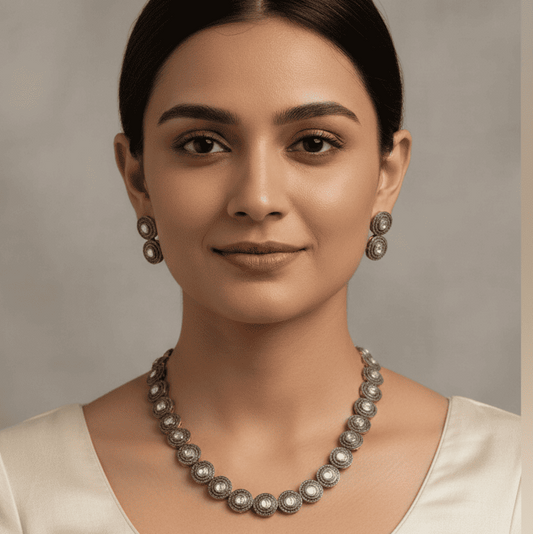 Polki handcrafted necklace and earring set worn by model in traditional attire