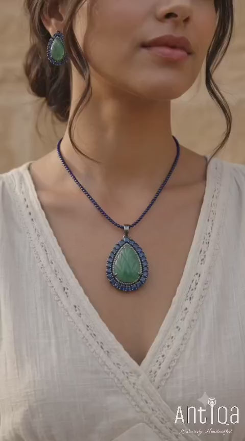 Handcrafted Green Beryl Pendant & Earrings Set showcasing 75 carats of leaf-carved Green Beryl with Blue Kyanite and diamond accents.