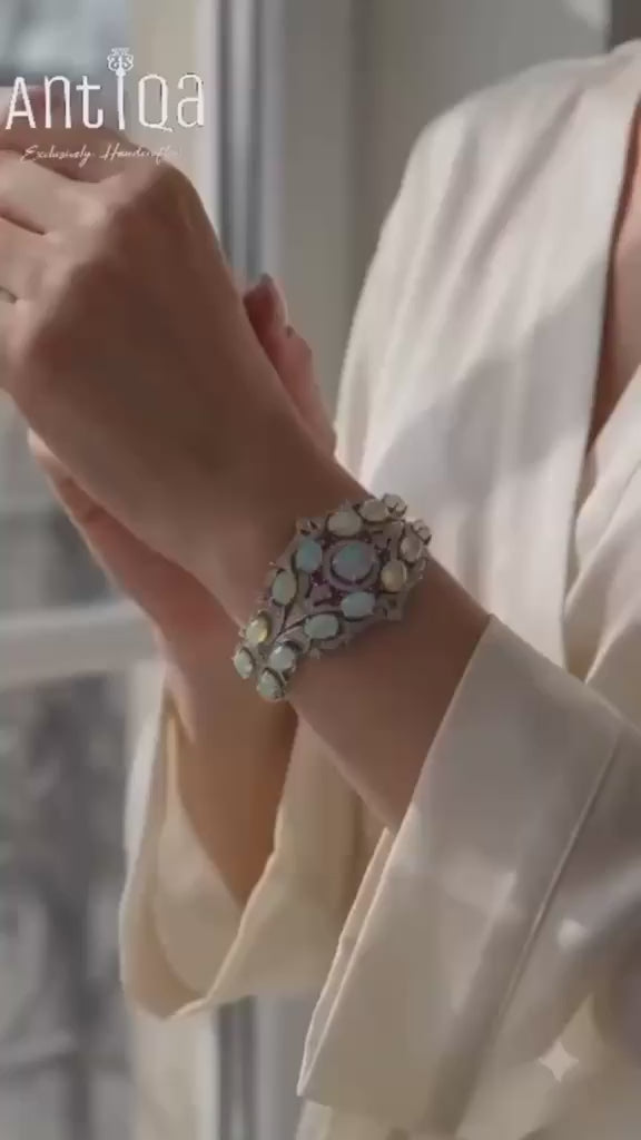 Video of handcrafted Ethiopian opal and ruby cuff bracelet with diamonds - Antiqa Handcrafted