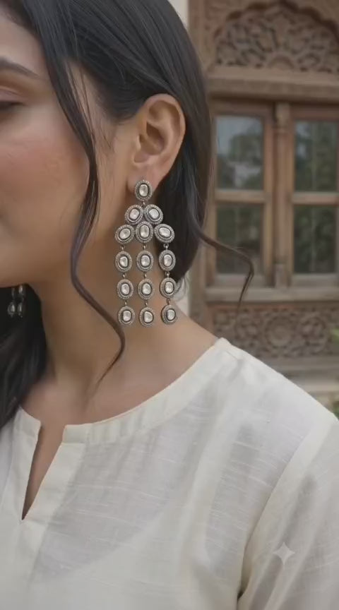 Front view of handcrafted Mughal Victorian chandelier earrings in oxidized 925 Sterling Silver with raw uncut diamonds